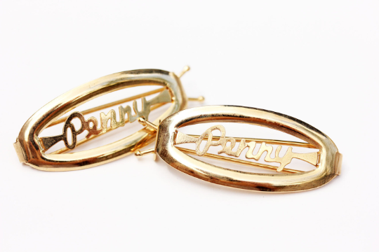 Vintage Penny gold hair clips from Diament Jewelry, a gift shop in Washington, DC.