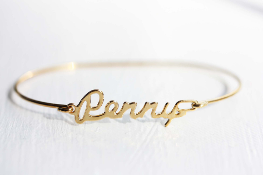 Vintage Penny gold name bracelet from Diament Jewelry, a gift shop in Washington, DC.