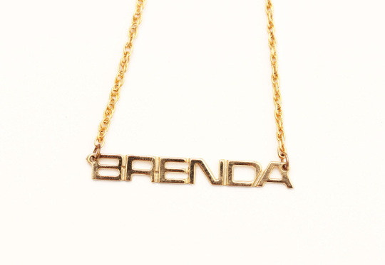Vintage Brenda gold name necklace from Diament Jewelry, a gift shop in Washington, DC.