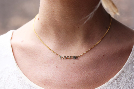 Vintage Marie gold name necklace from Diament Jewelry, a gift shop in Washington, DC.