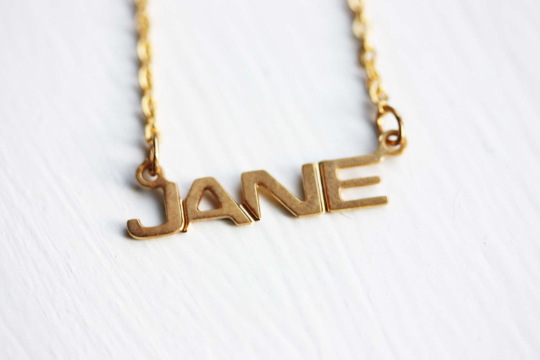 Vintage Jane gold name necklace from Diament Jewelry, a gift shop in Washington, DC.