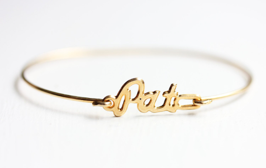 Vintage Pat gold name bracelet from Diament Jewelry, a gift shop in Washington, DC.