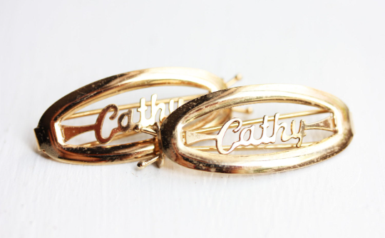 Vintage Cathy gold hair clips from Diament Jewelry, a gift shop in Washington, DC.