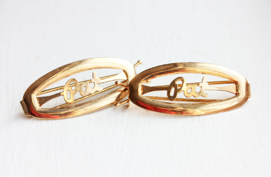 Vintage Pat gold hair clips from Diament Jewelry, a gift shop in Washington, DC.