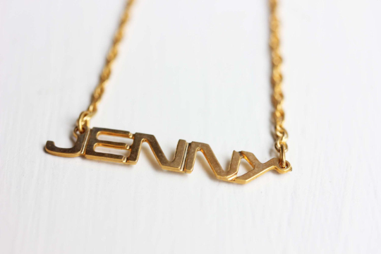 Vintage Jenny gold name necklace from Diament Jewelry, a gift shop in Washington, DC.