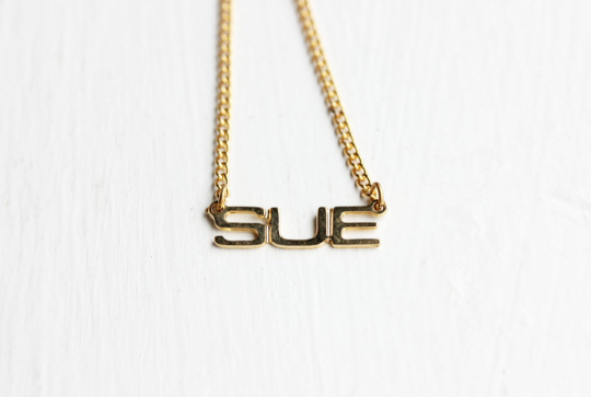Vintage Sue gold name necklace from Diament Jewelry, a gift shop in Washington, DC.
