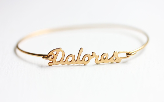 Vintage Dolores gold name bracelet from Diament Jewelry, a gift shop in Washington, DC.