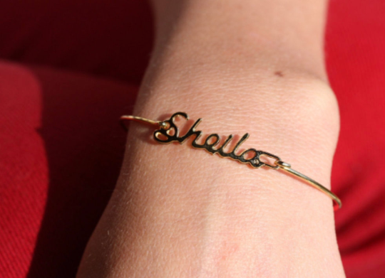 Vintage Sheila gold name bracelet from Diament Jewelry, a gift shop in Washington, DC.