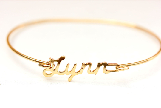 Vintage Lynn gold name bracelet from Diament Jewelry, a gift shop in Washington, DC.