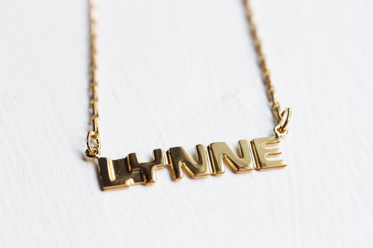 Vintage Lynne gold name necklace from Diament Jewelry, a gift shop in Washington, DC.