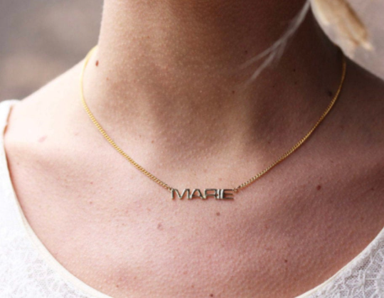 Vintage Marie gold name necklace from Diament Jewelry, a gift shop in Washington, DC.