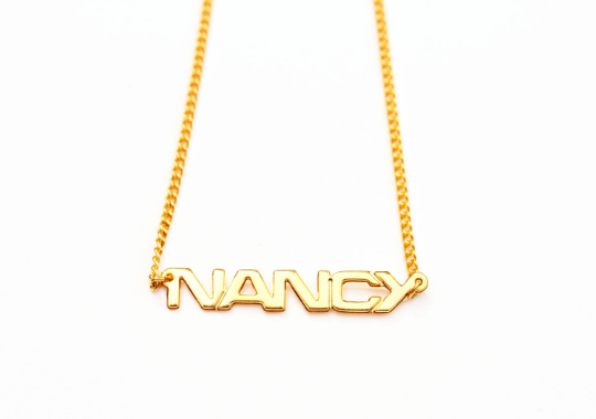 Vintage Nancy gold name necklace from Diament Jewelry, a gift shop in Washington, DC.