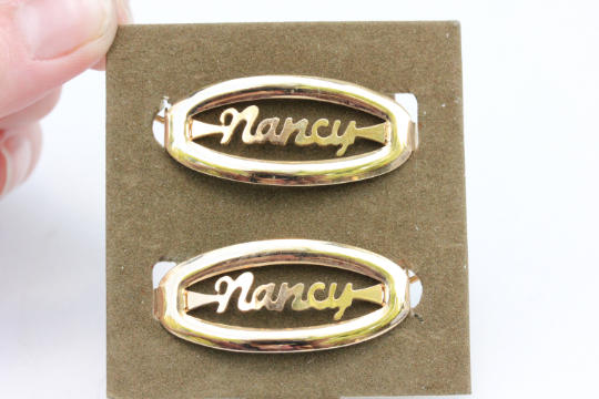 Vintage Nancy gold hair clips from Diament Jewelry, a gift shop in Washington, DC.