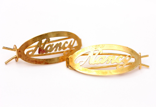 Vintage Nancy gold hair clips from Diament Jewelry, a gift shop in Washington, DC.