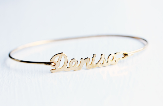 Vintage Denise gold name bracelet from Diament Jewelry, a gift shop in Washington, DC.