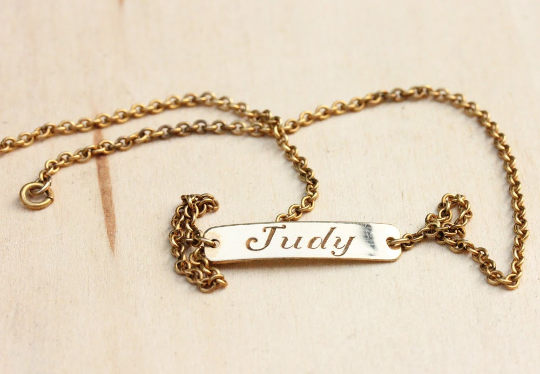 Vintage Judy gold name necklace from Diament Jewelry, a gift shop in Washington, DC.