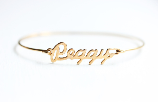 Vintage Peggy gold name bracelet from Diament Jewelry, a gift shop in Washington, DC.