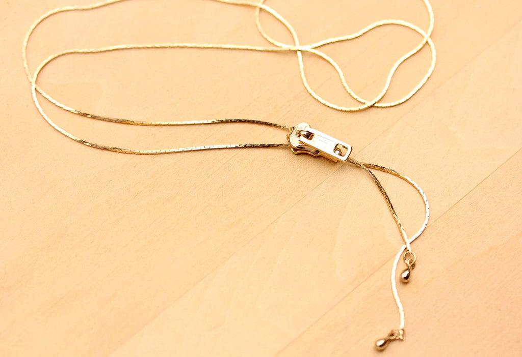 Gold Zipper Necklace from Diament Jewelry, a gift shop in Washington, DC.
