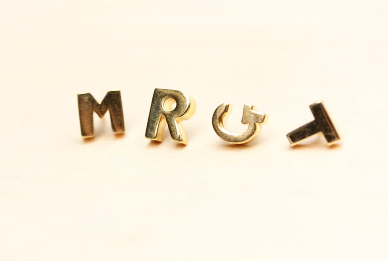 Gold and Silver Plated Initial Pins from Diament Jewelry, a gift shop in Washington, DC.