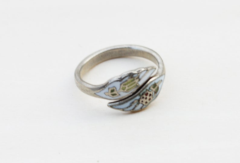 White Enamel Flower Ring from Diament Jewelry, a gift shop in Washington, DC.