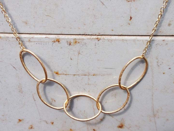 Gold oval necklace from Diament Jewelry, a gift shop in Washington, DC.
