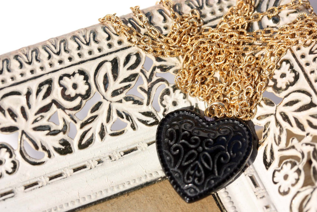 Sweet long black heart gold necklace from Diament Jewelry, a gift shop in Washington, DC.