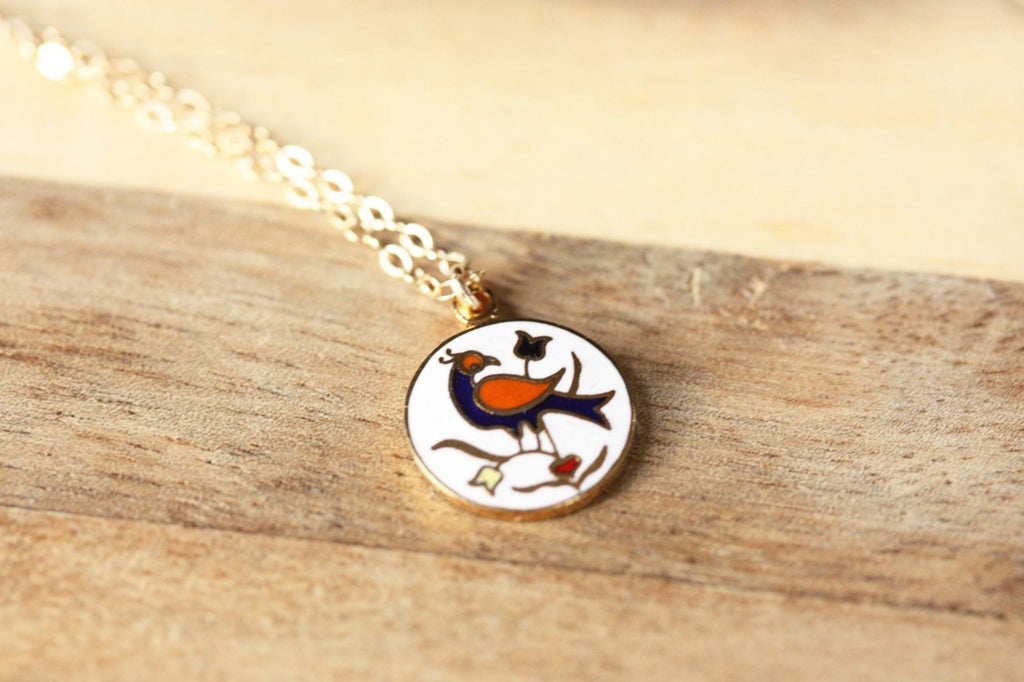Vintage bird charm necklace from Diament Jewelry, a gift shop in Washington, DC.