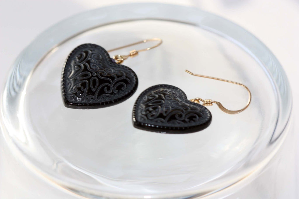 Embossed black heart dangle earrings from Diament Jewelry, a gift shop in Washington, DC.