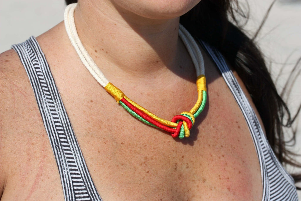 Green, yellow, red, and white rope knot necklace from Diament Jewelry, a gift shop in Washington, DC.