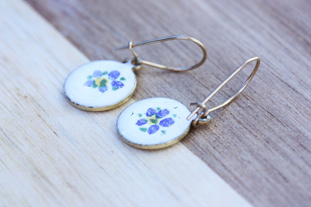 Vintage white and gold flower drop earrings from Diament Jewelry, a gift shop in Washington, DC.