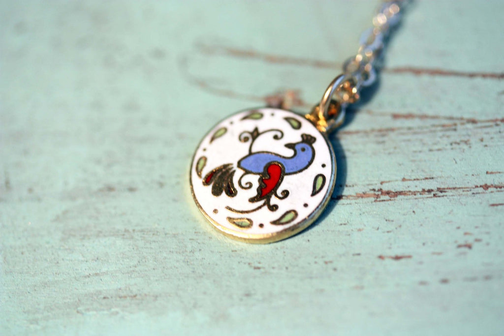 Vintage circle bird charm necklace from Diament Jewelry, a gift shop in Washington, DC.