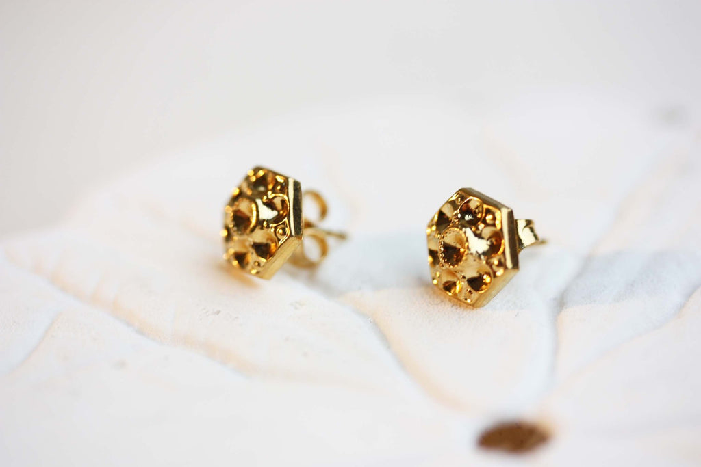 Geometric gold flower studs from Diament Jewelry, a gift shop in Washington, DC.