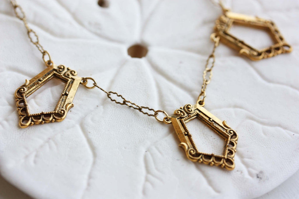 Vintage gold chain trapezoid necklace from Diament Jewelry, a gift shop in Washington, DC.