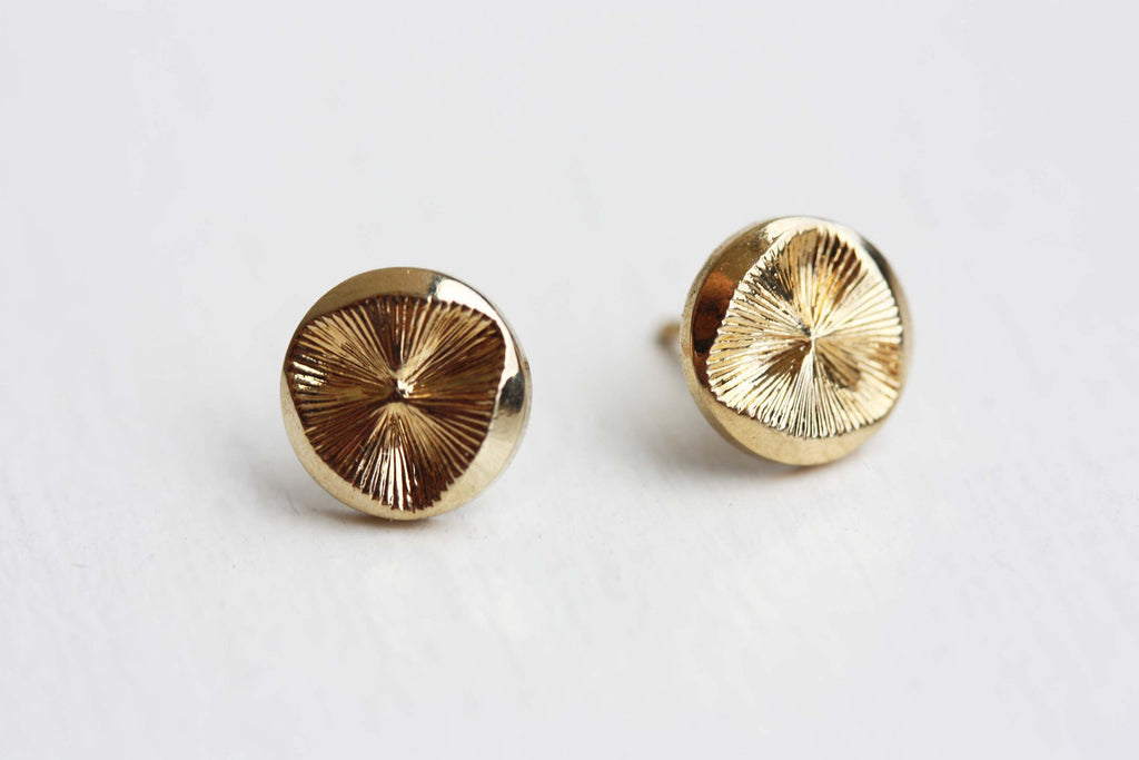 Vintage gold disc studs from Diament Jewelry, a gift shop in Washington, DC.