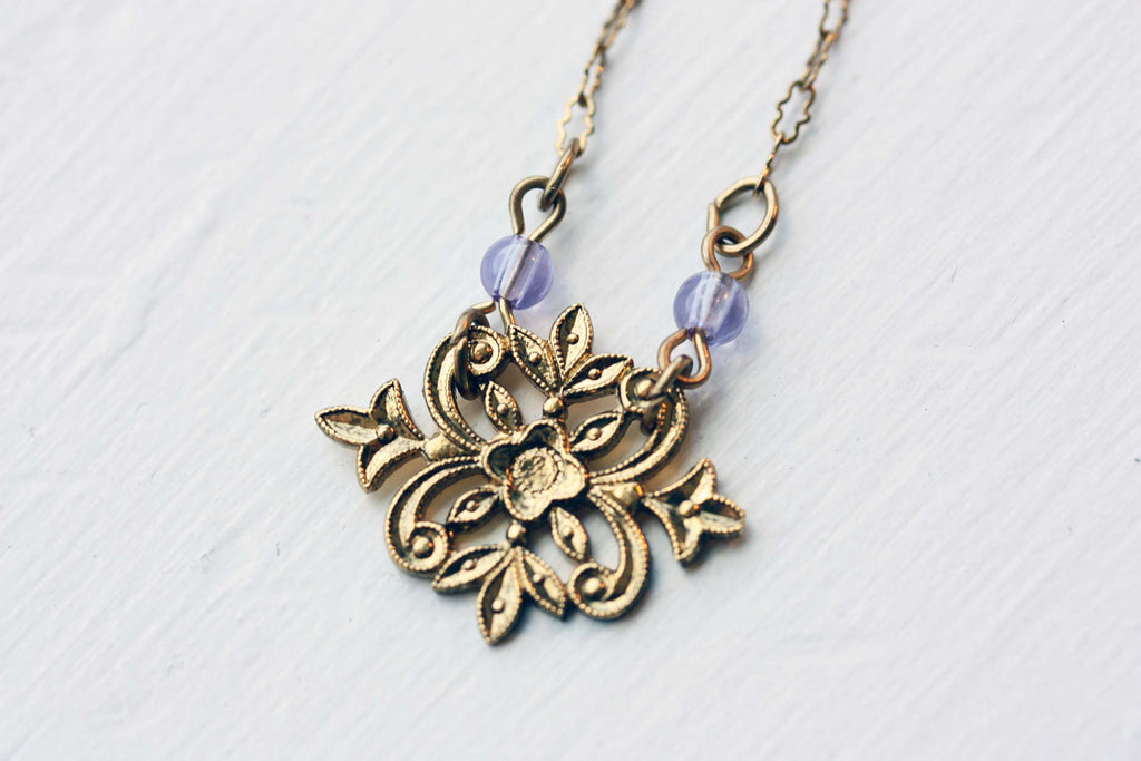 Filigree gold flower necklace from Diament Jewelry, a gift shop in Washington, DC.