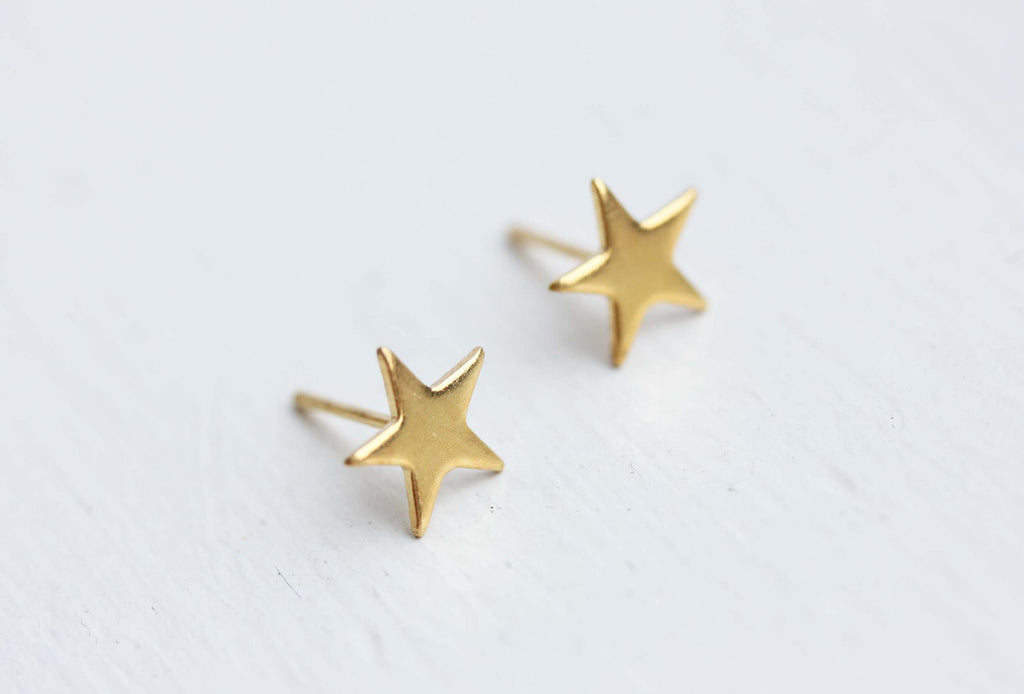 Tiny gold star studs from Diament Jewelry, a gift shop in Washington, DC.