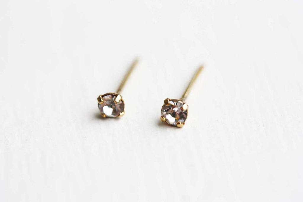 Tiny clear crystal dot studs from Diament Jewelry, a gift shop in Washington, DC.