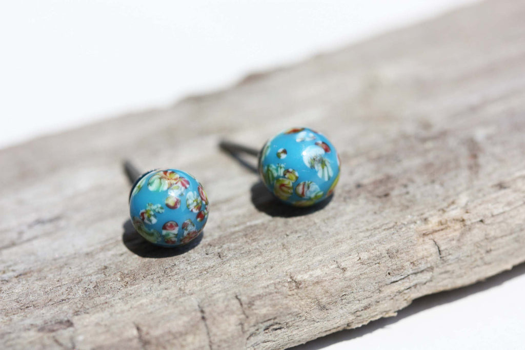 Vintage Japanese blue confetti studs from Diament Jewelry, a gift shop in Washington, DC.