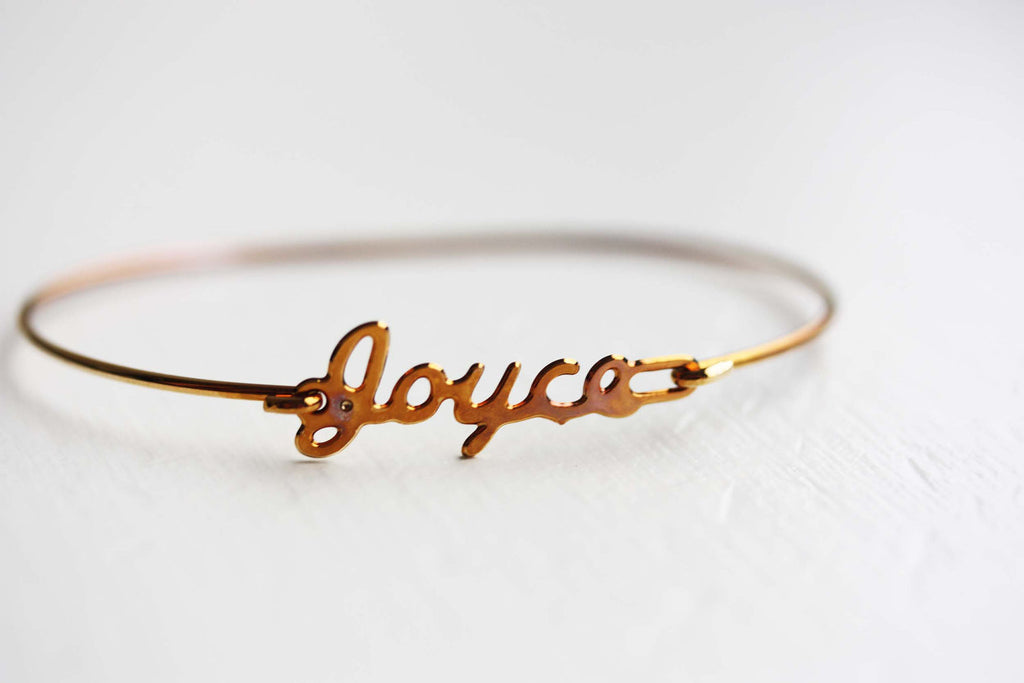 Vintage Joyce gold name bracelet from Diament Jewelry, a gift shop in Washington, DC.
