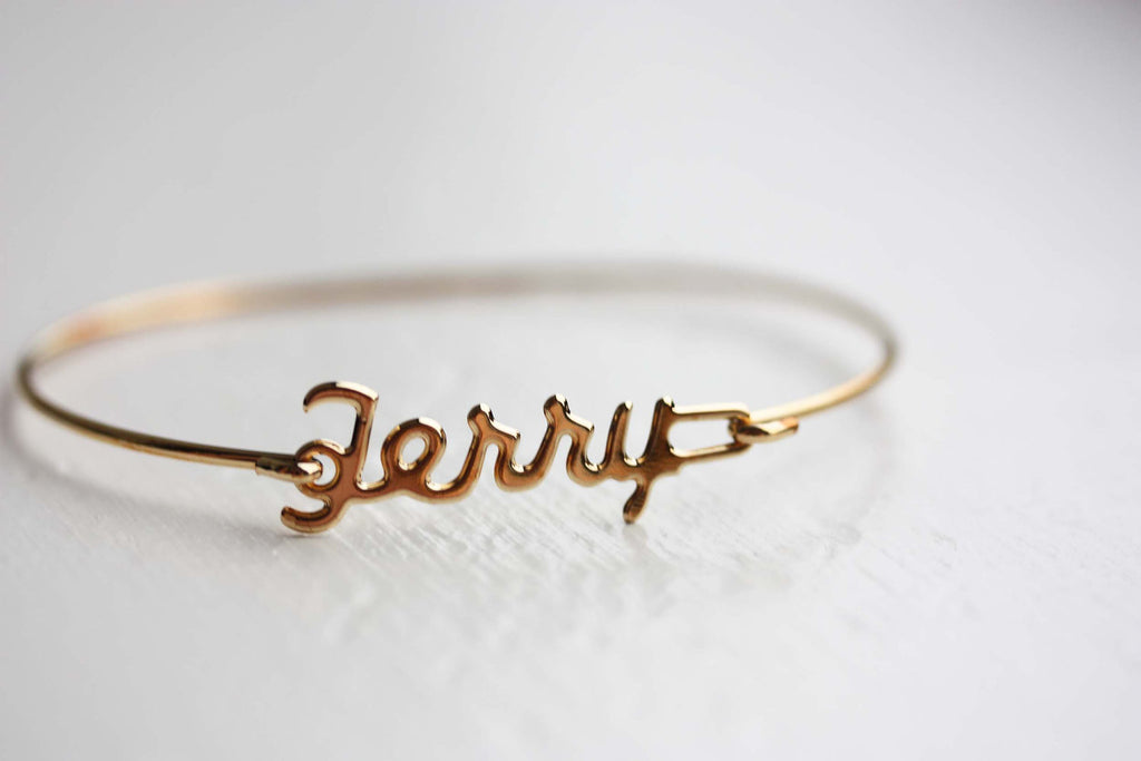 Vintage Terry gold name bracelet from Diament Jewelry, a gift shop in Washington, DC.
