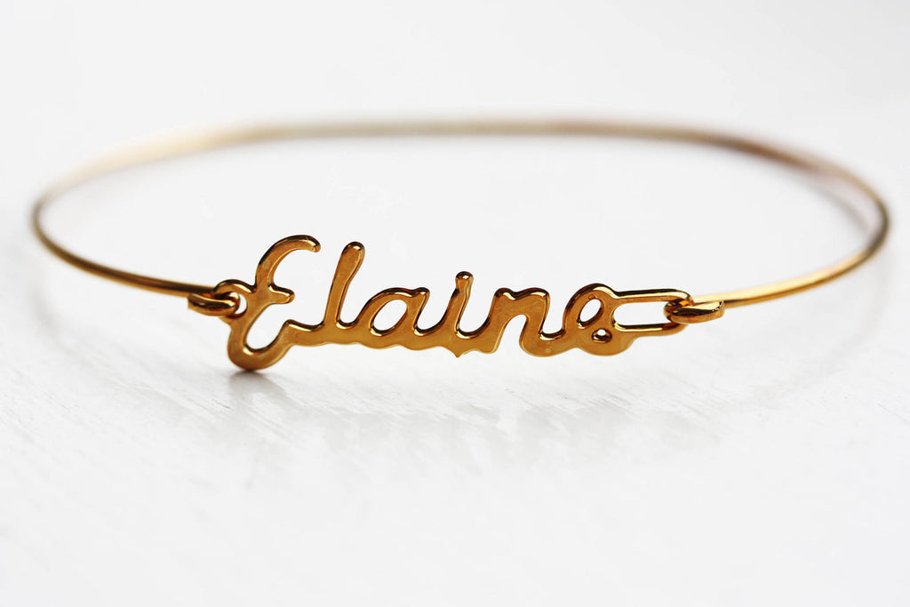 Vintage gold Elaine name bracelet from Diament Jewelry, a gift shop in Washington, DC.
