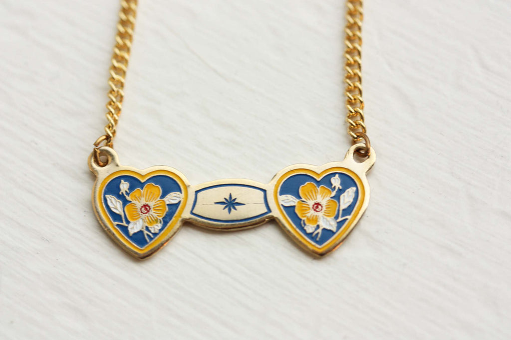 Double heart blue and yellow necklace from Diament Jewelry, a gift shop in Washington, DC.