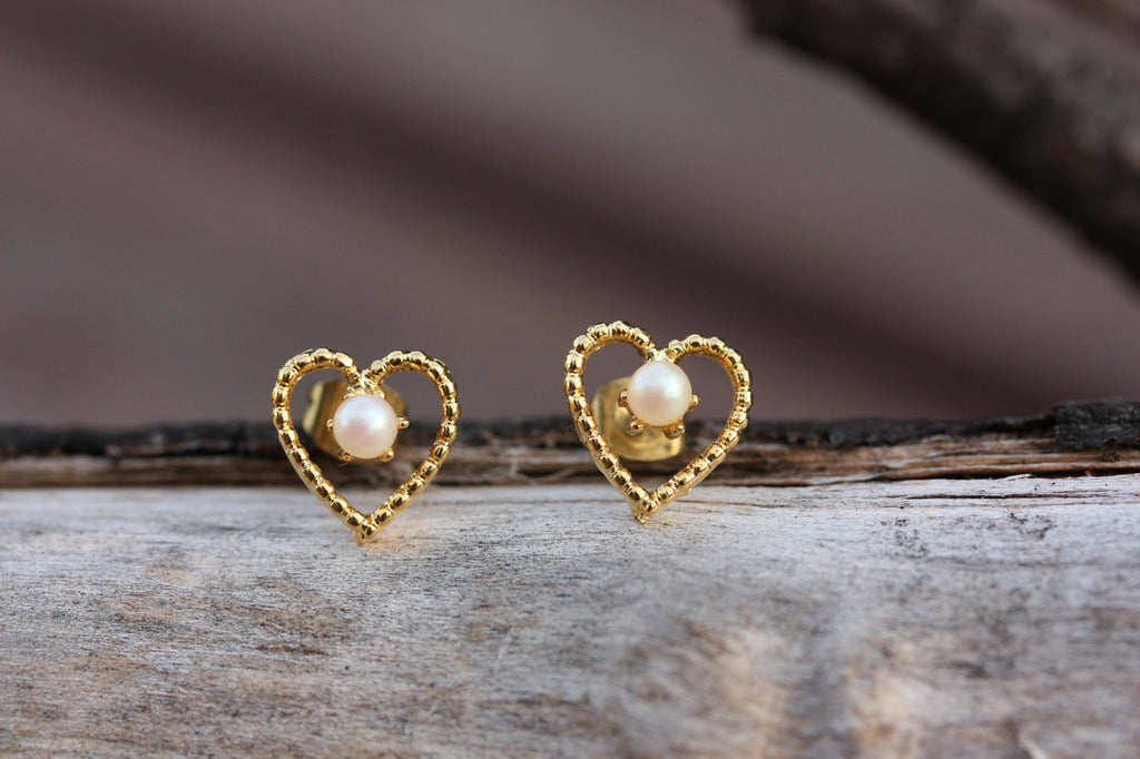Gold heart and pearl wire studs from Diament Jewelry, a gift shop in Washington, DC.