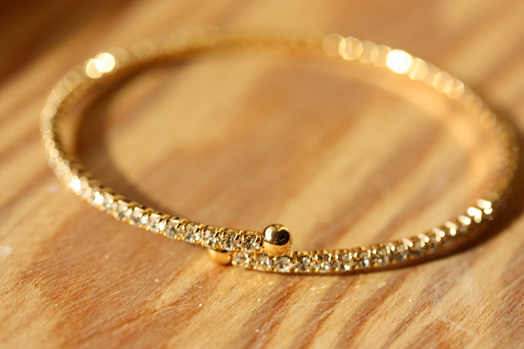 Delicate gold crystal adjustable bracelet from Diament Jewelry, a gift shop in Washington, DC.