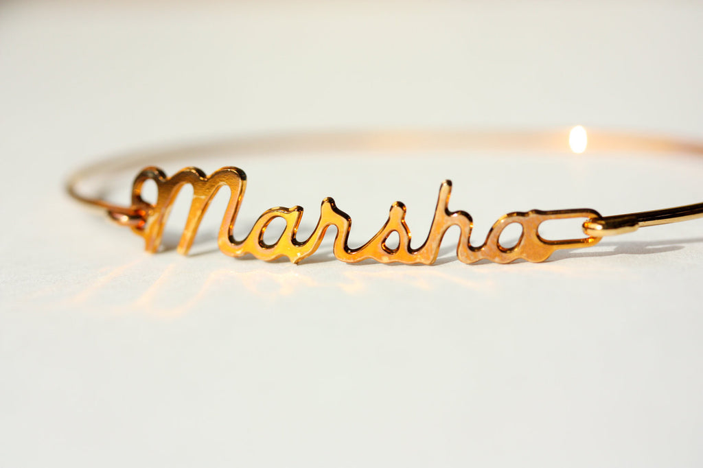 Vintage Marsha gold name bracelet from Diament Jewelry, a gift shop in Washington, DC.
