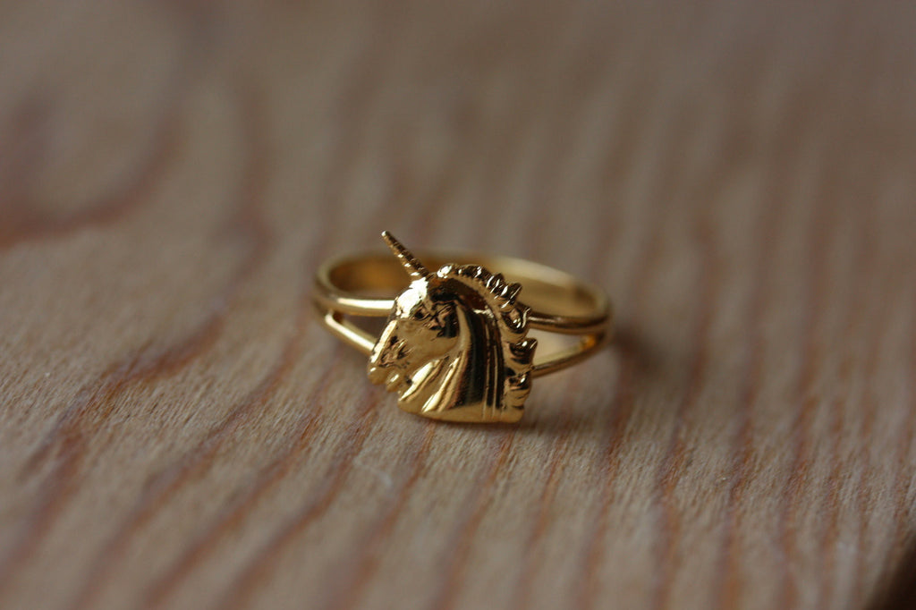 Vintage small gold unicorn ring from Diament Jewelry, a gift shop in Washington, DC.