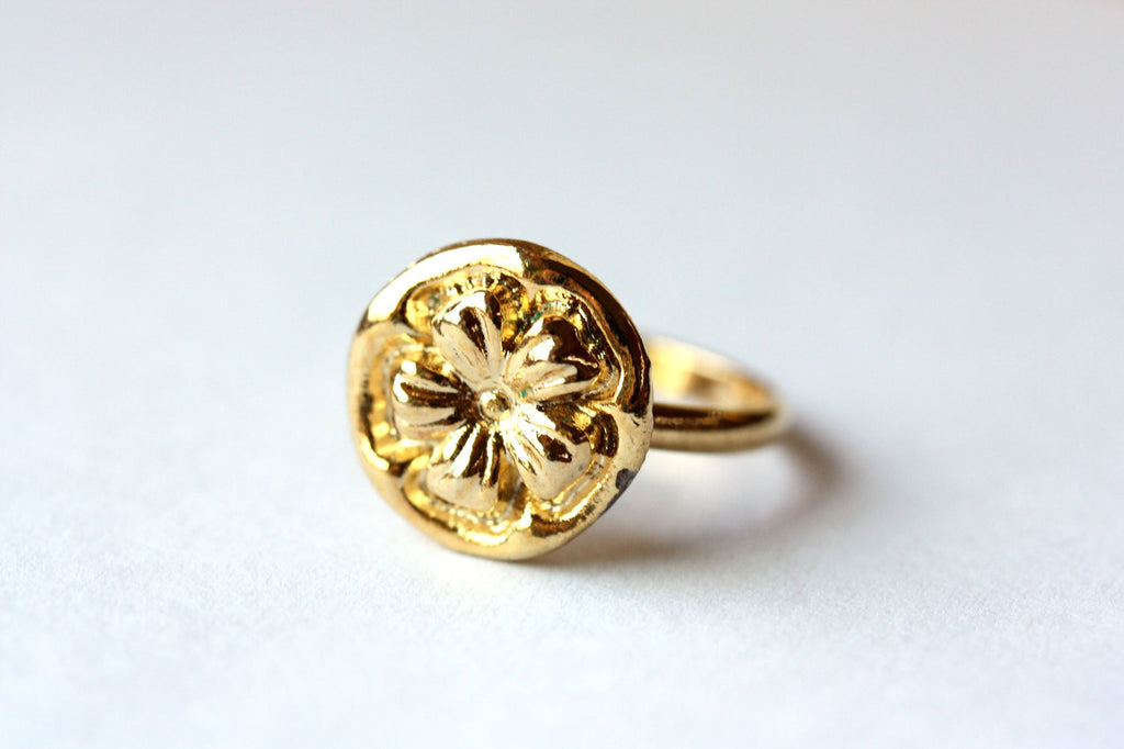 Gold flower circle ring from Diament Jewelry, a gift shop in Washington, DC.
