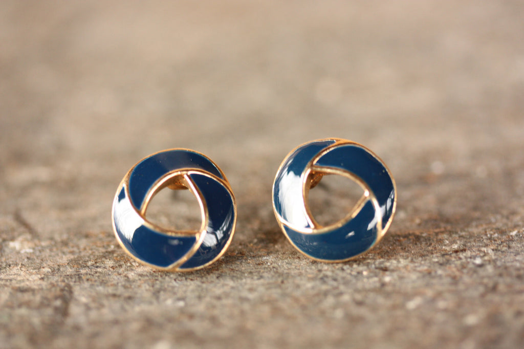 Navy and gold knot circles from Diament Jewelry, a gift shop in Washington, DC.