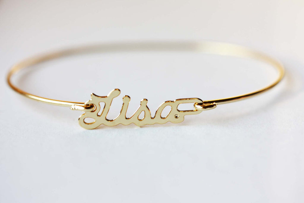 Vintage Lisa gold name bracelet from Diament Jewelry, a gift shop in Washington, DC.