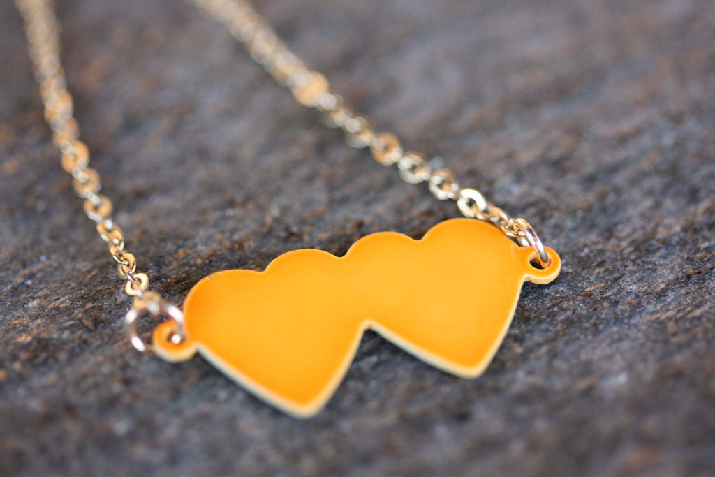 Neon double heart charm necklace from Diament Jewelry, a gift shop in Washington, DC.